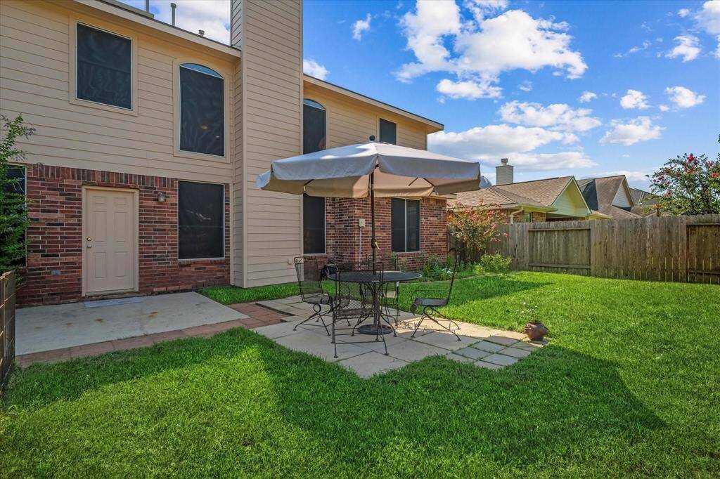 Backyard- table and chairs for staging only.