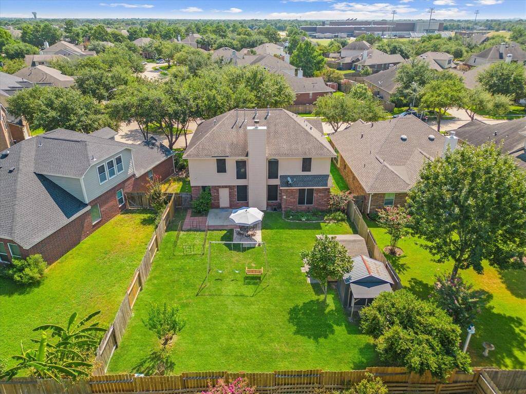 Huge Backyard with extra storage. ( Play set, dog run and one shed will be removed prior to leasing)