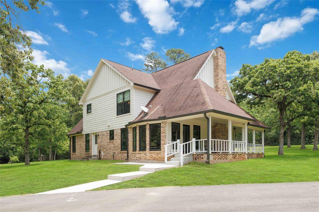 Welcome to Magnolia, Texas, to this stunning country home in the Glenmont Estates subdivision. It rests on a sloping ravine on a 4+ acre secluded lot surrounded by trees.