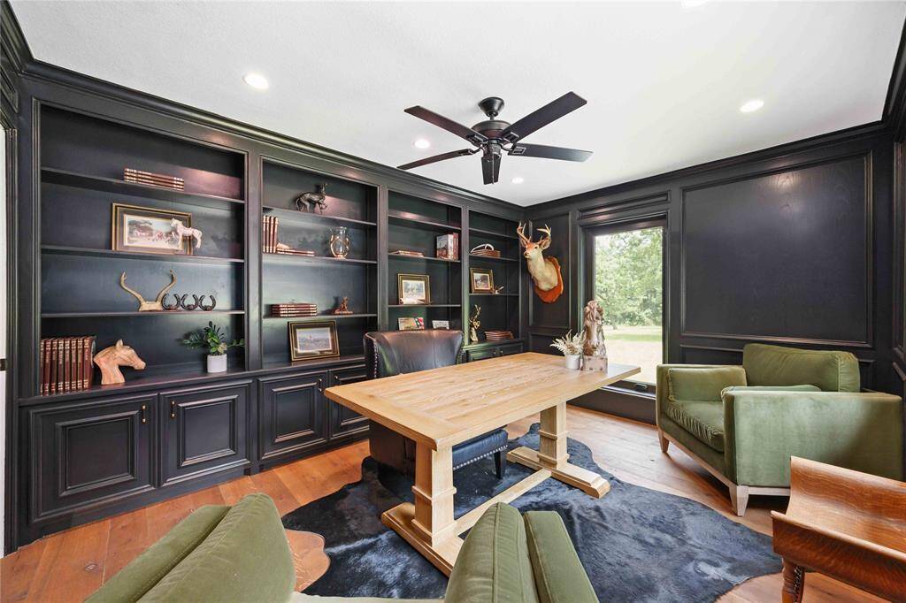 Enjoy the sleek contrast in colors in this room that provides plenty of space for a desk and a sitting area.
