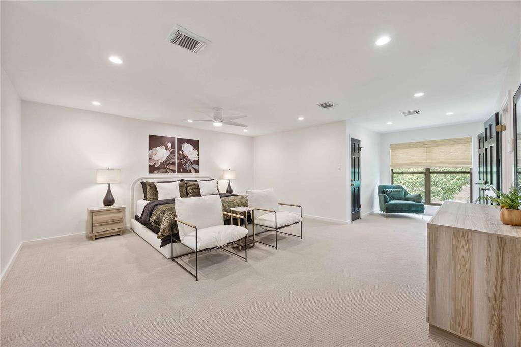 Another angle shows an additional sitting area where you might enjoy relaxing with a good book.