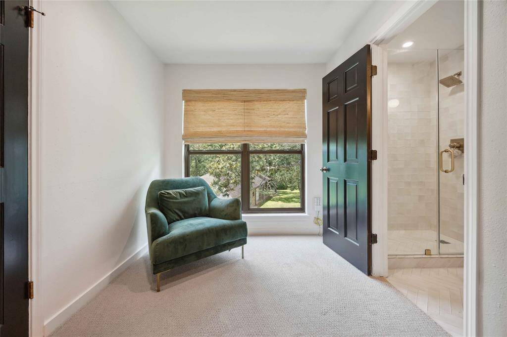 Near the sitting area is the entry to the primary bath.