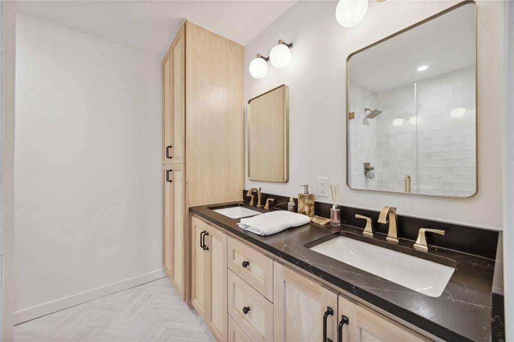 As with the other bathrooms, you'll love the granite counters, white oak cabinetry, and premium fixtures in the primary bath.