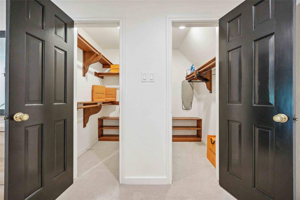 Walk-in closets in the primary suite include built-in shelving.