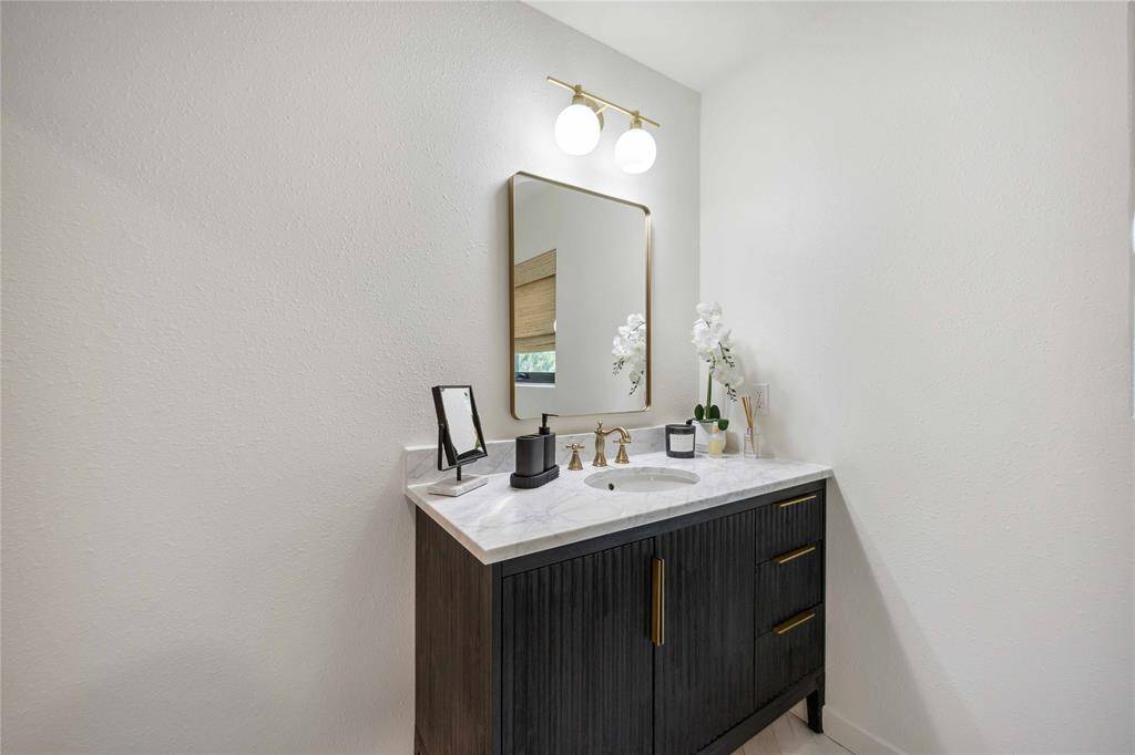 The 3rd bath kept with the design of the others with its beautiful countertops and fixtures.