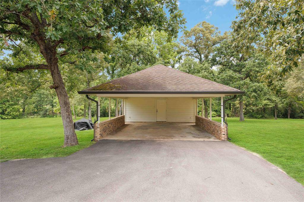 A workshop and a carport offer the versatility to become a guest house.