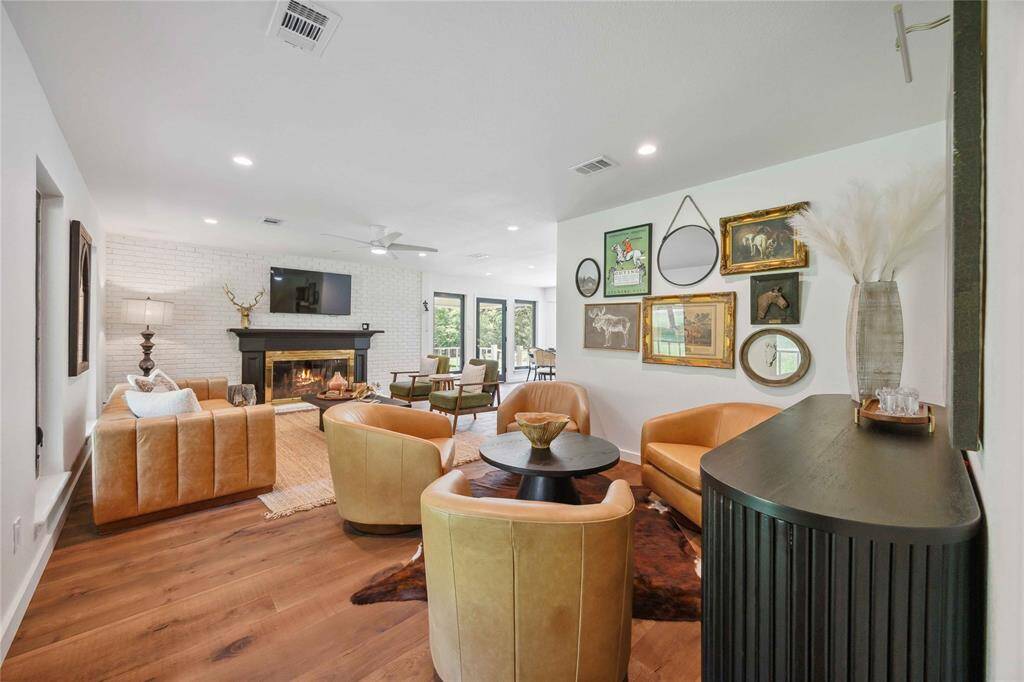 Tucked to the side of the living room is a flex space perfect for a bar and lounge area or a quiet library.