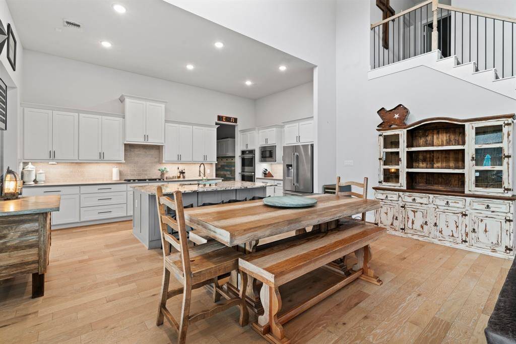 Elegant and inviting. The view from the dining area highlights the seamless flow between the kitchen and living room combining comfort with classic design.