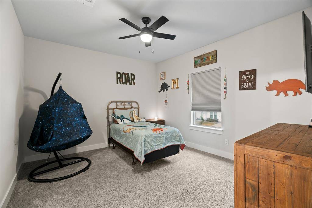 Dino-mite design! A playful and spacious bedroom with plenty of room to grow, learn, and imagine.