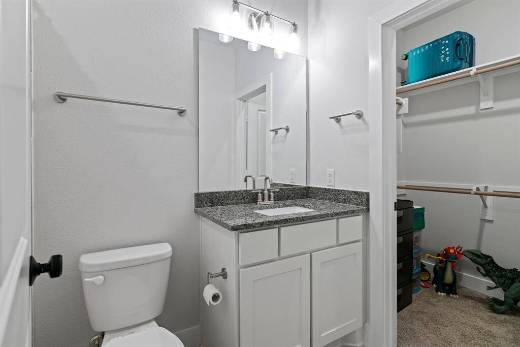 The bathroom and walk-in closet offer both comfort and convenience