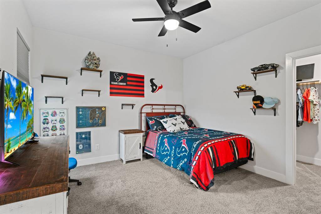 This fun and stylish secondary bedroom comes complete with its own private bath and walk-in closet