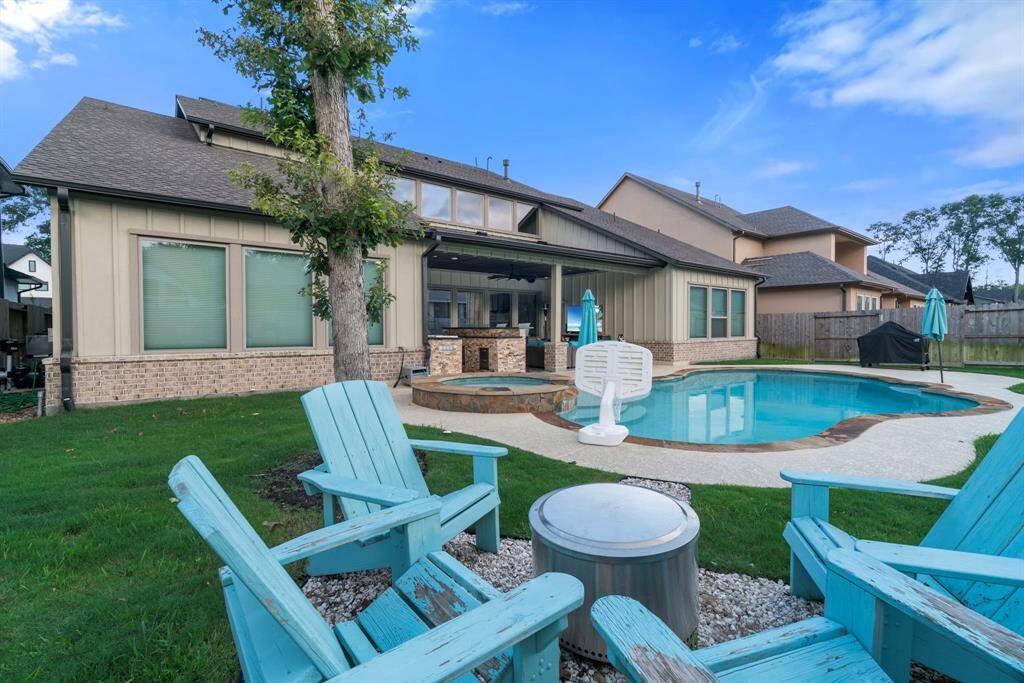 Enjoy evenings from this cozy firepit area with views of the pool and patio.