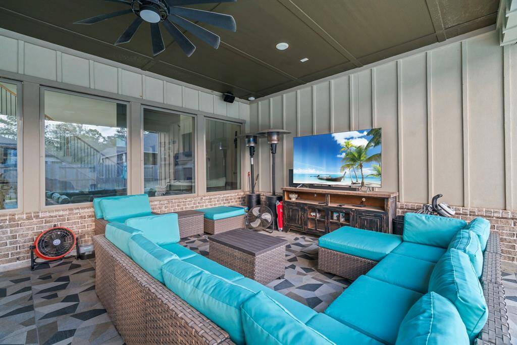 Your outdoor living room. Covered patio with tile flooring—relaxation starts here.