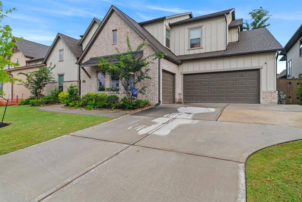 Spacious three-car garage and wide driveway offer ample parking for your vehicles and guests.