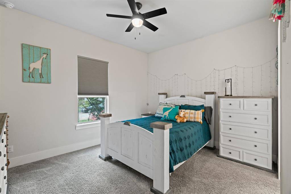 Charming secondary bedroom with natural light and cozy comfort.