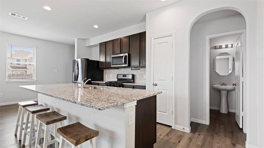 half bath tucked in the main room with a large storage closet within