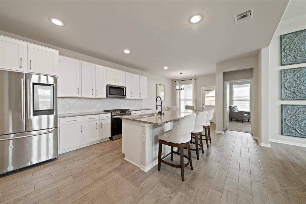 The breakfast area conveniently off the kitchen and attached to the living area is perfect for your morning coffee!