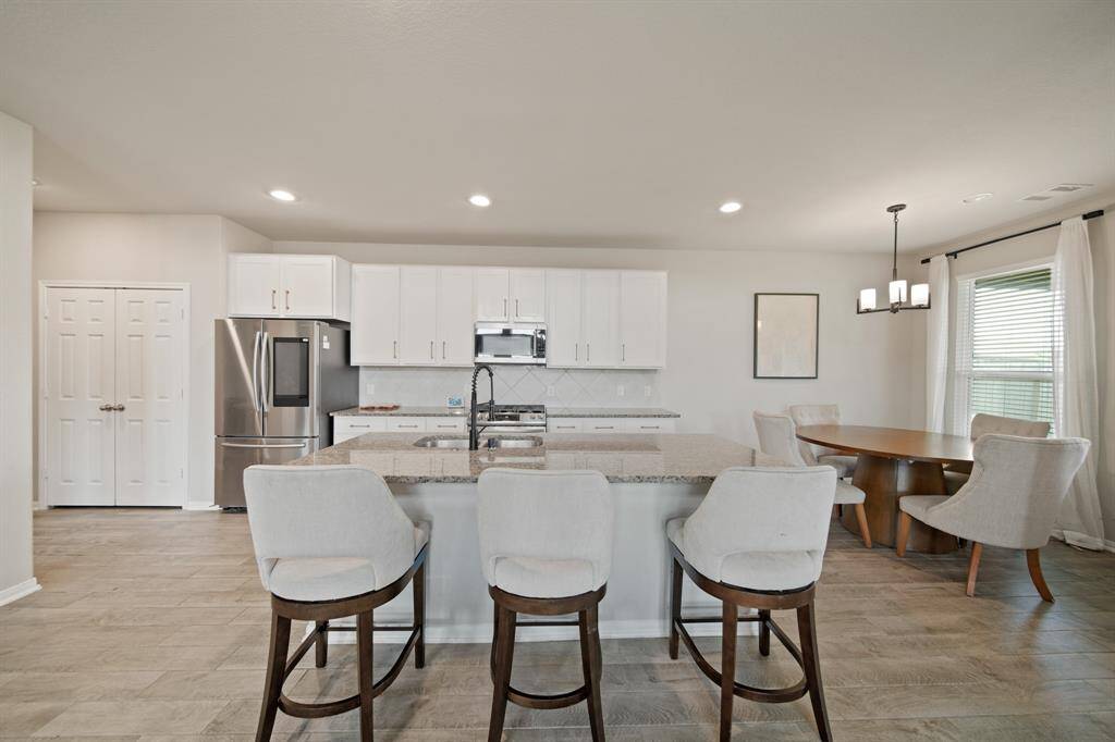 Whip up a meal for your family, friends, and guests while still being a part of all of the action!