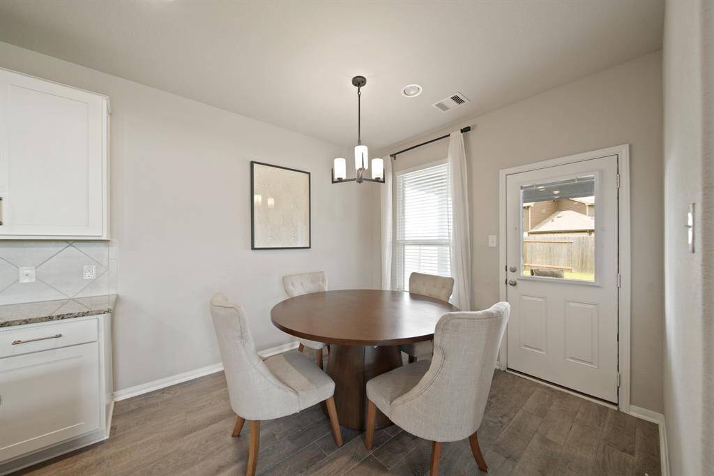 Virtually Staged: Conveniently tucked away in the back of the home is this beautiful home study, featuring carpet floors, and great views into your backyard.
