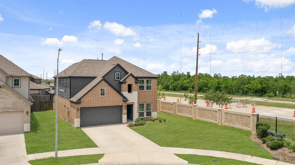 This captivating home boasts a grand curbside appeal - highlighting the beautiful brick, and array of windows.