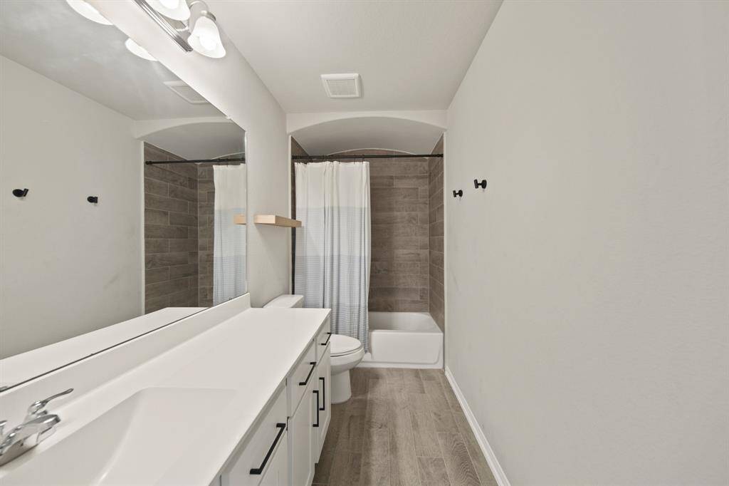 Virtually Staged: Secondary bedroom with carpet floors, and windows with privacy blinds.