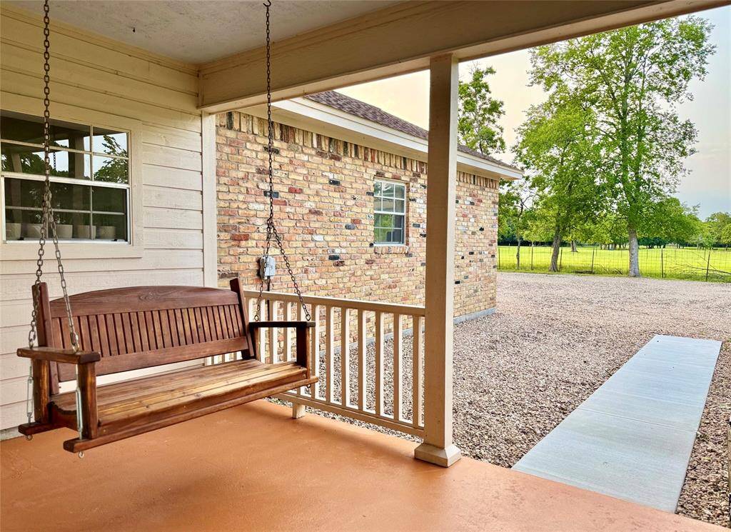 A built in porch swing will stay with the property.