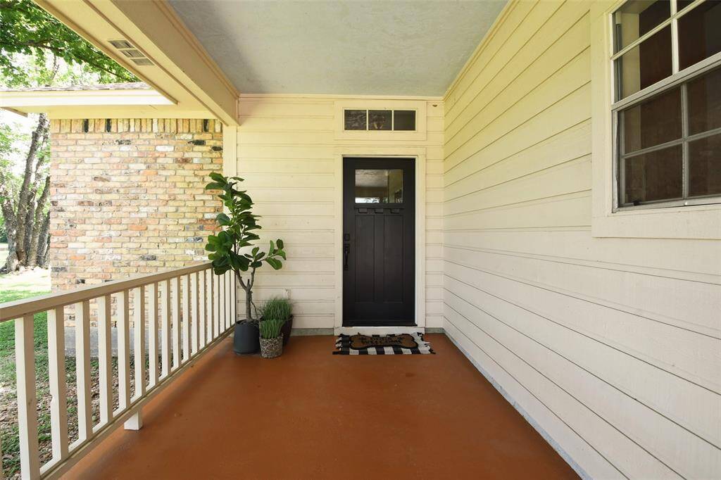 The primary residence has a brand new front door that leads to an inviting living area.