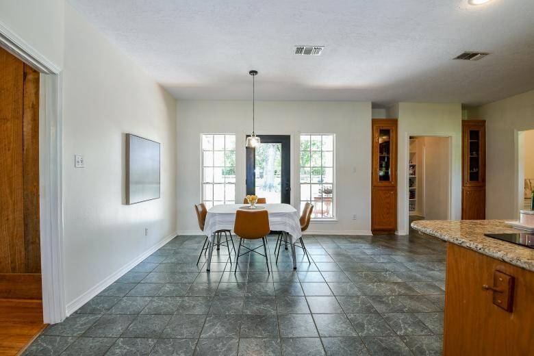 The open dining area leads out to the covered patio.