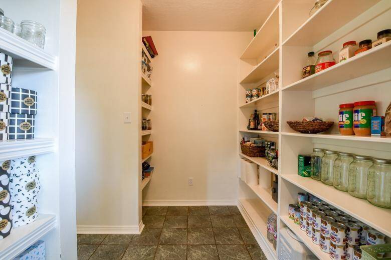 The huge kitchen has an equally large, open pantry adjacent to the laundry room.