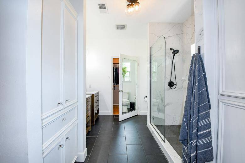 The primary bathroom was exquisitely designed with a modern flair.