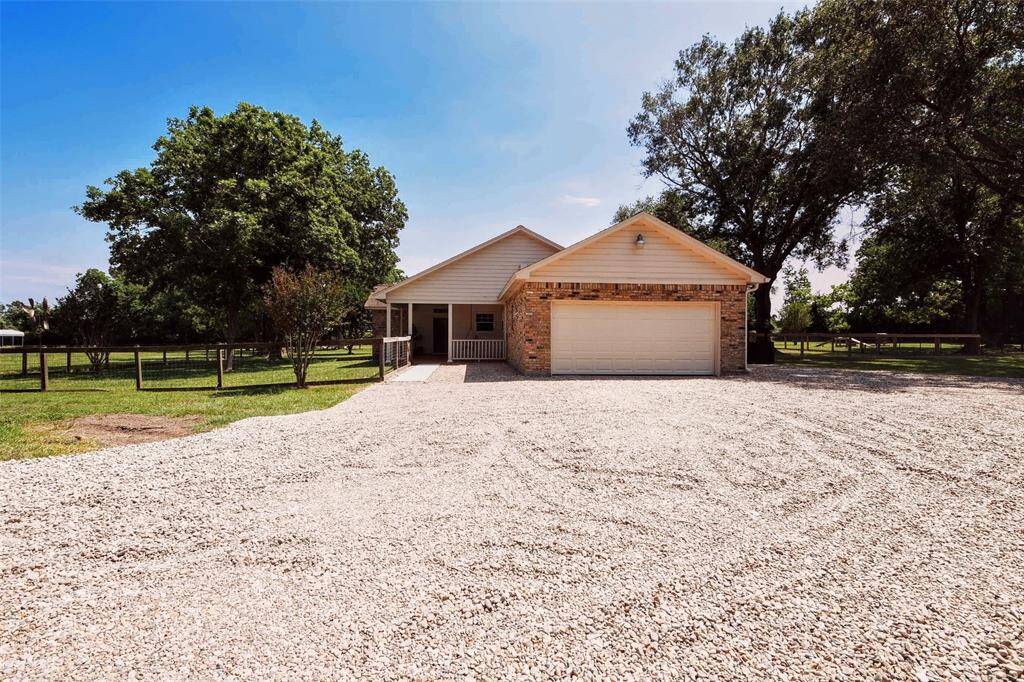 100 tons of river rock was placed to create a lasting gravel driveway.