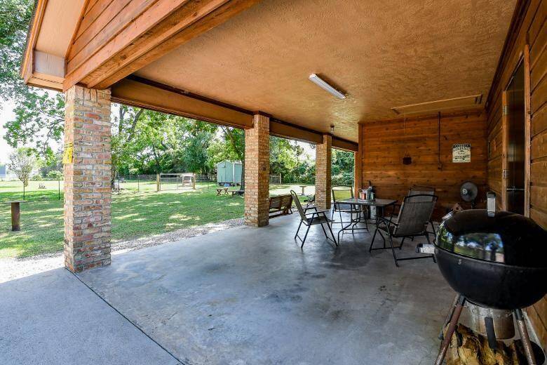 The covered porch has a ramp for additional vehicle parking or for relaxing.