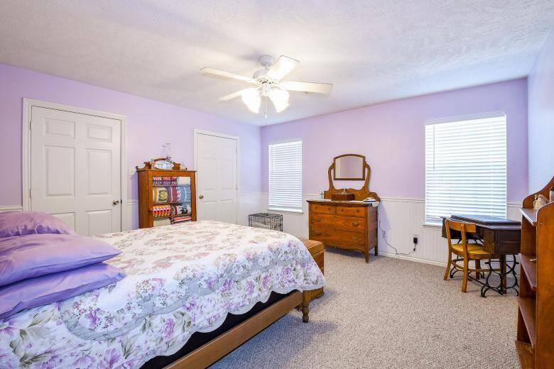 The primary bedroom in the second residence (15x14) has durable, neutral carpeting.