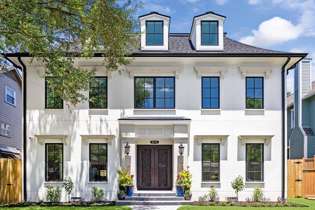 Welcome to 2216 Tangley Street! This incredible new construction 3 story home features a classic white facade with black-framed windows and third floor dormers.