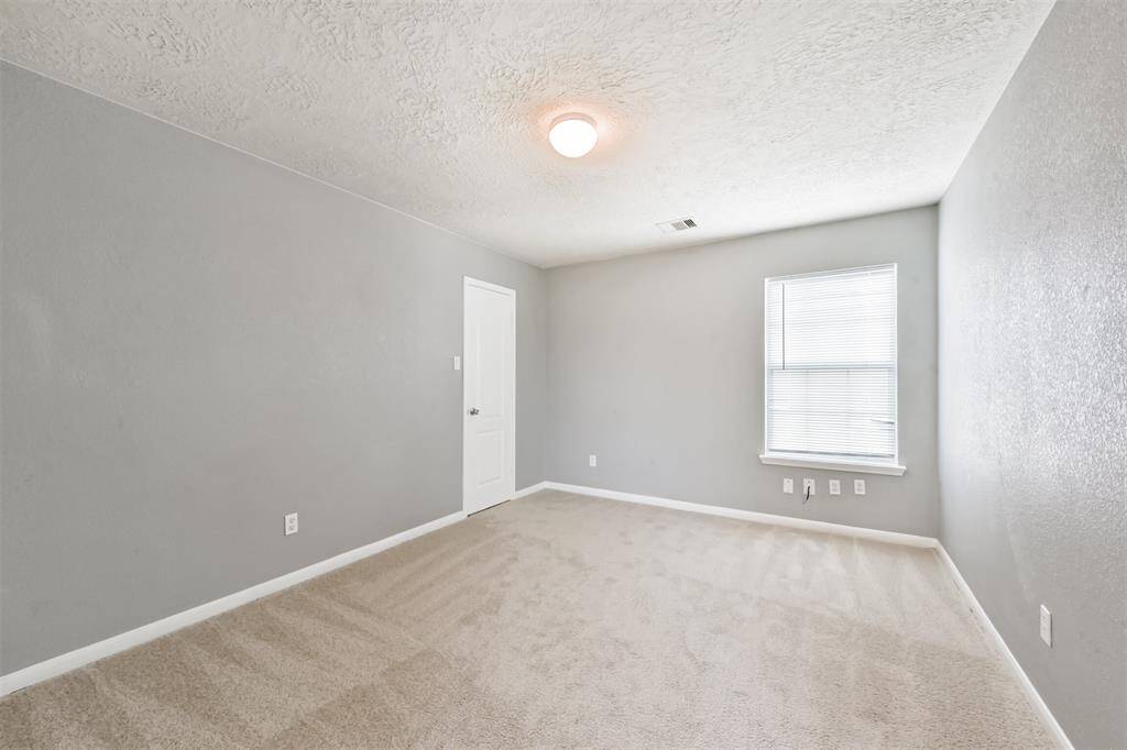 Secondary bedroom with ample natural light.