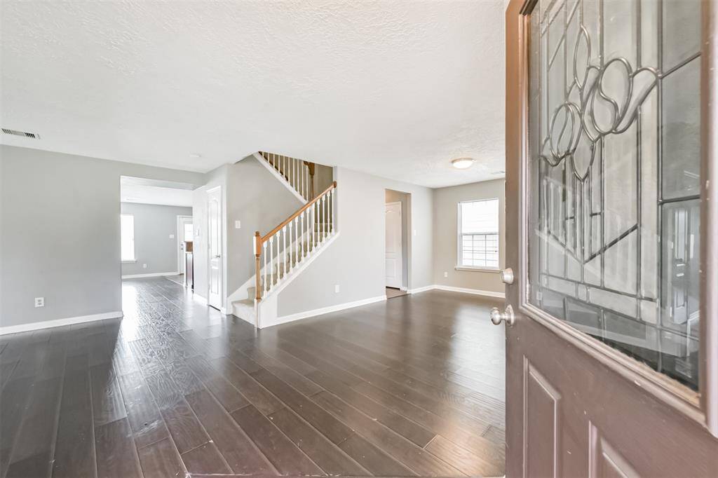 Elegant entrance featuring a leaded glass door.