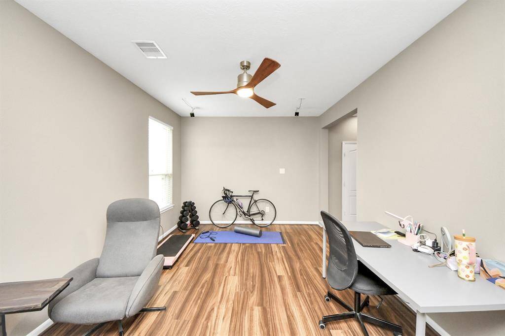 The home office also has a large window with plenty of natural lighting.