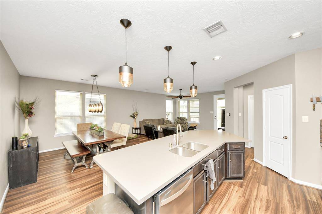 The kitchen overlooks the dining room.