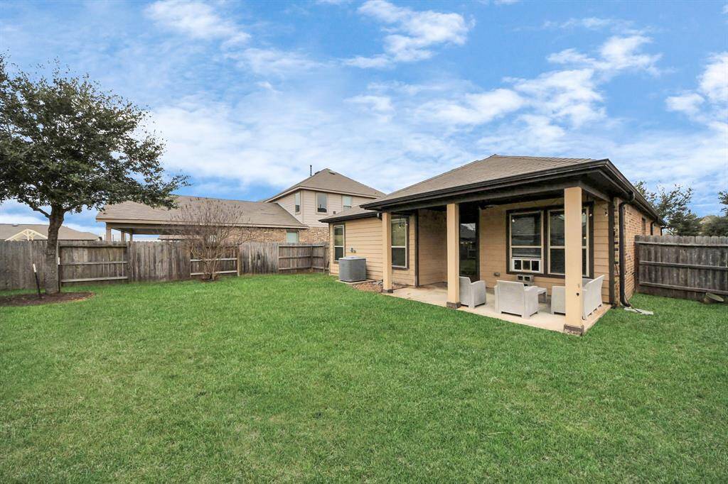 Sit back, relax and enjoy yourgorgeous backyard while under your covered patio!