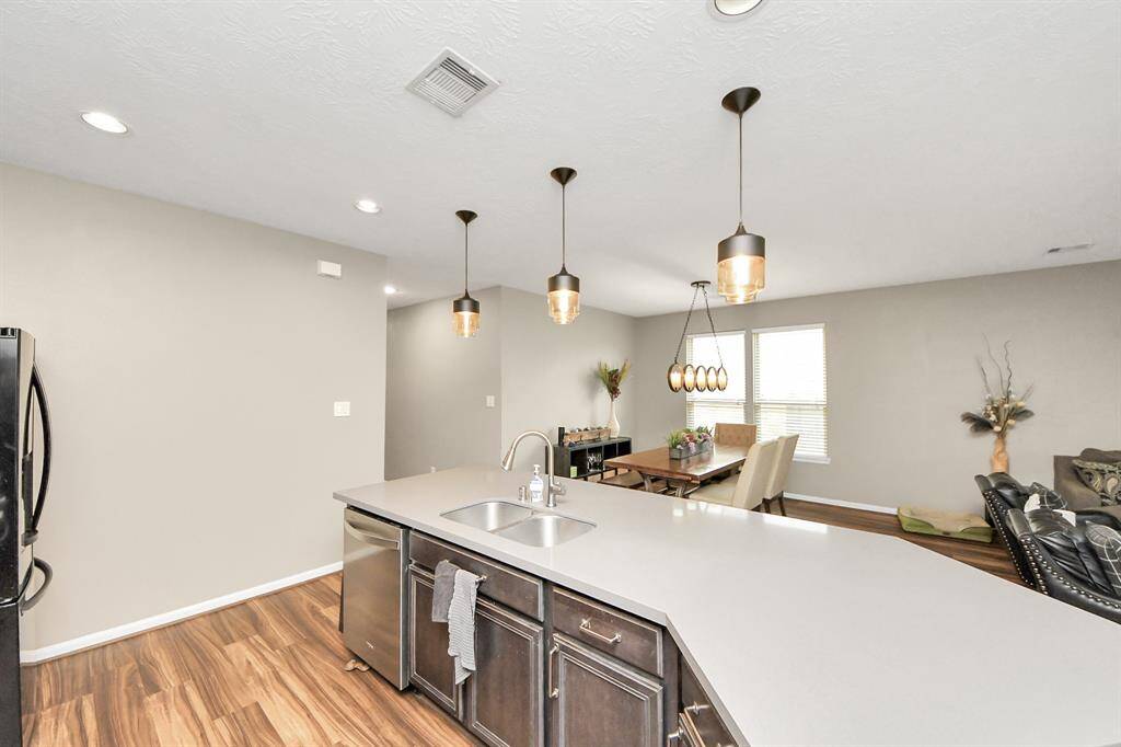 The kitchen island is perfect forconversation or that much neededspace to lay out your party spread foreveryone to enjoy.