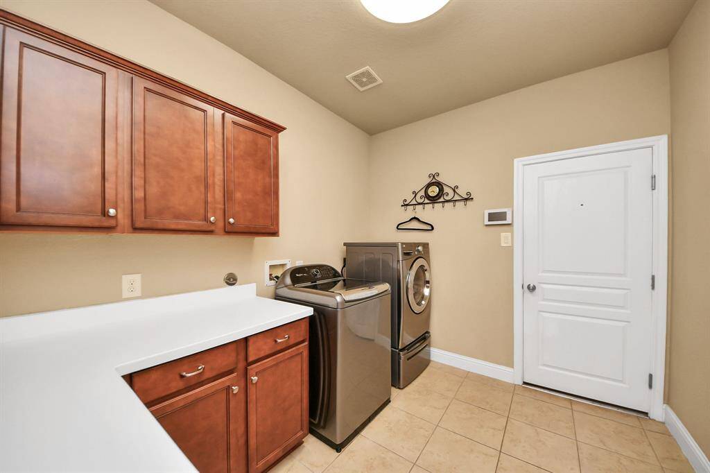 Laundry room with builtins.