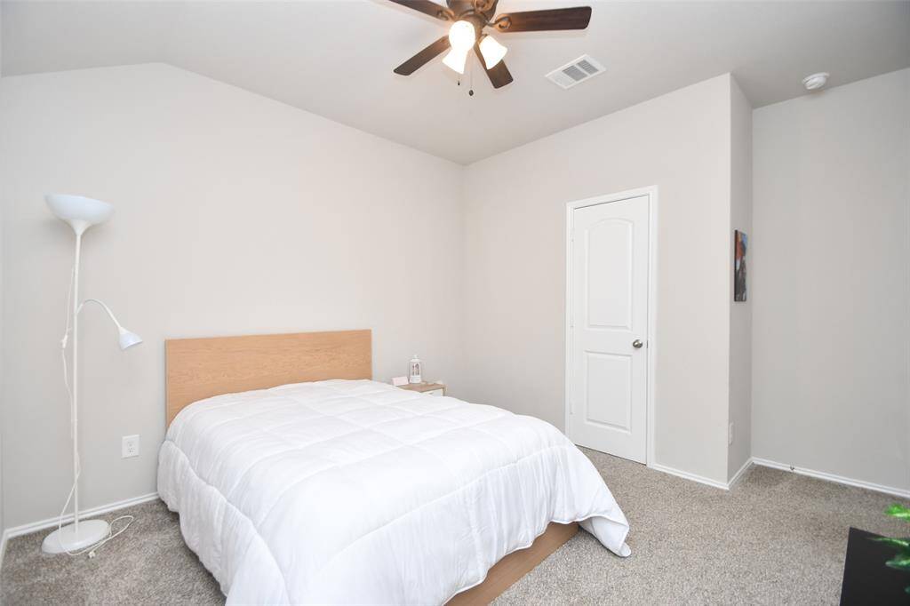 A spacious carpeted secondary bedroom also welcomes sizeable pieces.