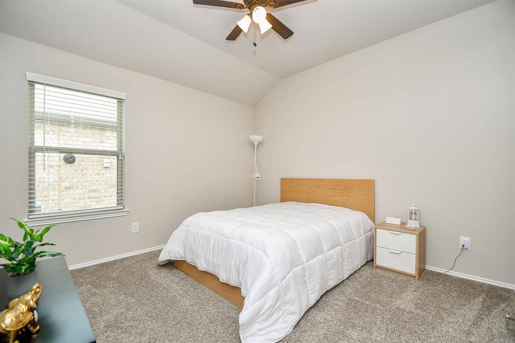 The off-center placement of the window in this secondary bedroom gives you more wall/floor space!