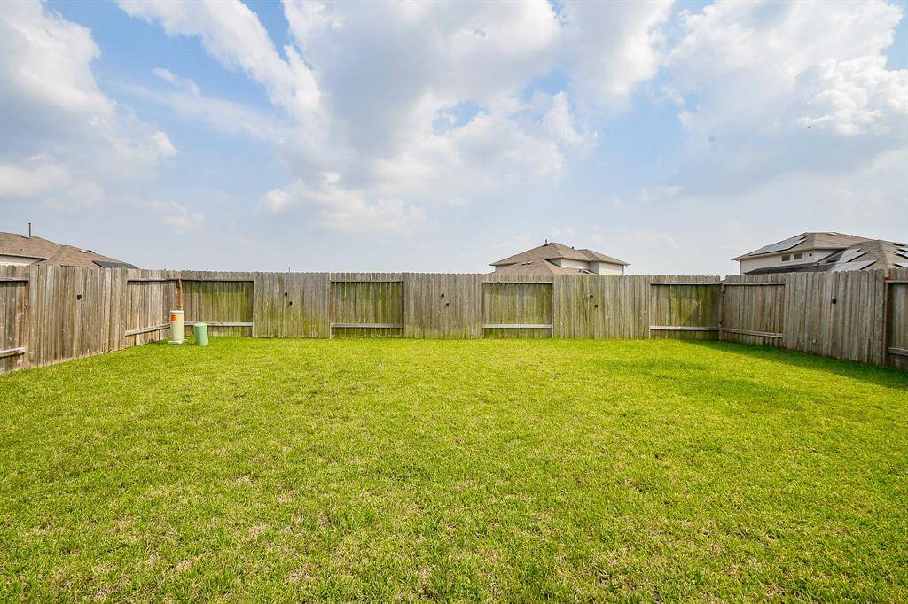 Wow! Temperatures are warming. How about a casual outdoor housewarming party? Privacy fencing surrounds it all!