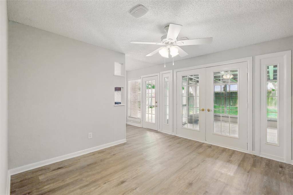 Double doors off the breakfast room leading out to the large screened-in patio.