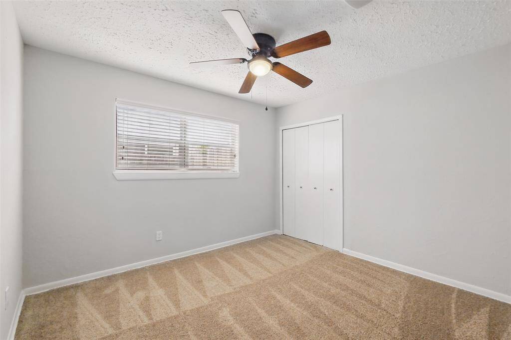 Bedroom #3 with a ceiling fan.