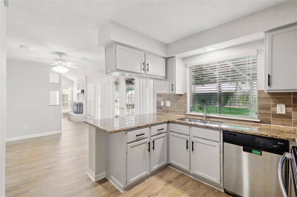 Plenty of granite counterspace for food prep and serving.