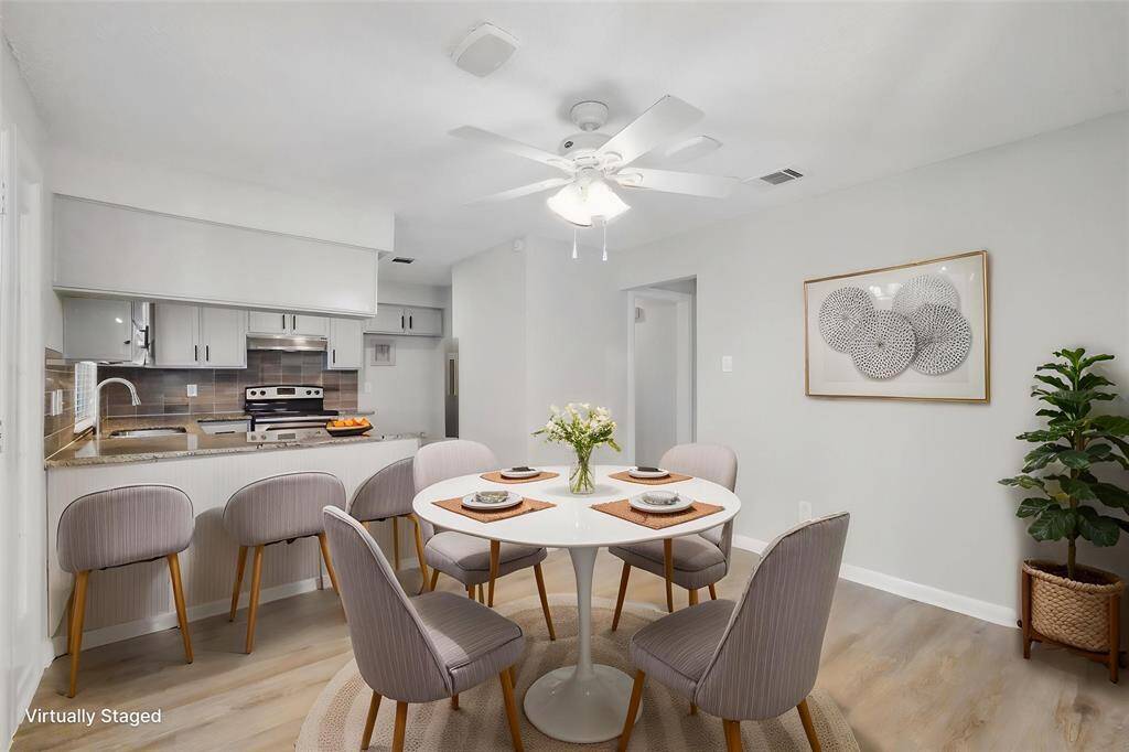 Virtually staged breakfast room.