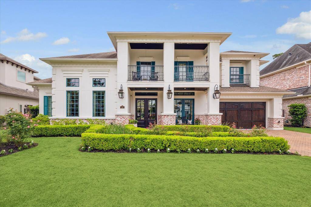 Nothing compares to the irresistible curb appeal of this custom designed French Colonial golf course estate perched on the second Fairway of The Woodlands Country Club Gary Player Golf Course.