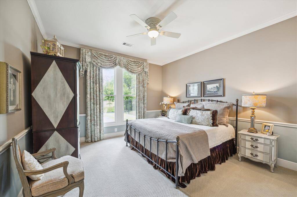 The first floor secondary bedroom suite is spacious, easily accommodating this king size bed and armoire, as well as any amount of baggage your guest brings. A walk-in closet and en-suite bath ensure privacy. This en-suite guest bath also conveniently serves as a pool bath for outdoor guests.